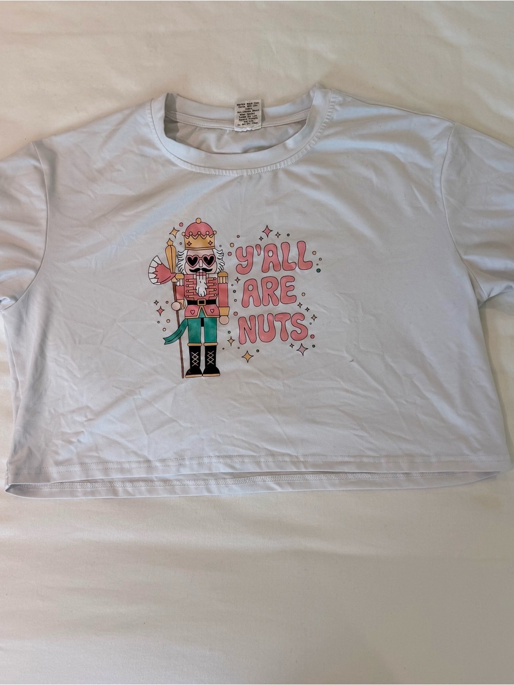 White Crop Tee with Pink Nutcracker Graphic - "Y'all Are Nuts"